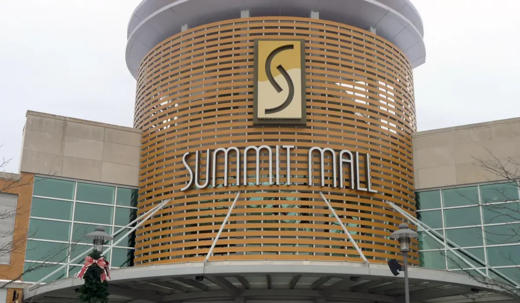 A sign on a large building at Summit Mall.