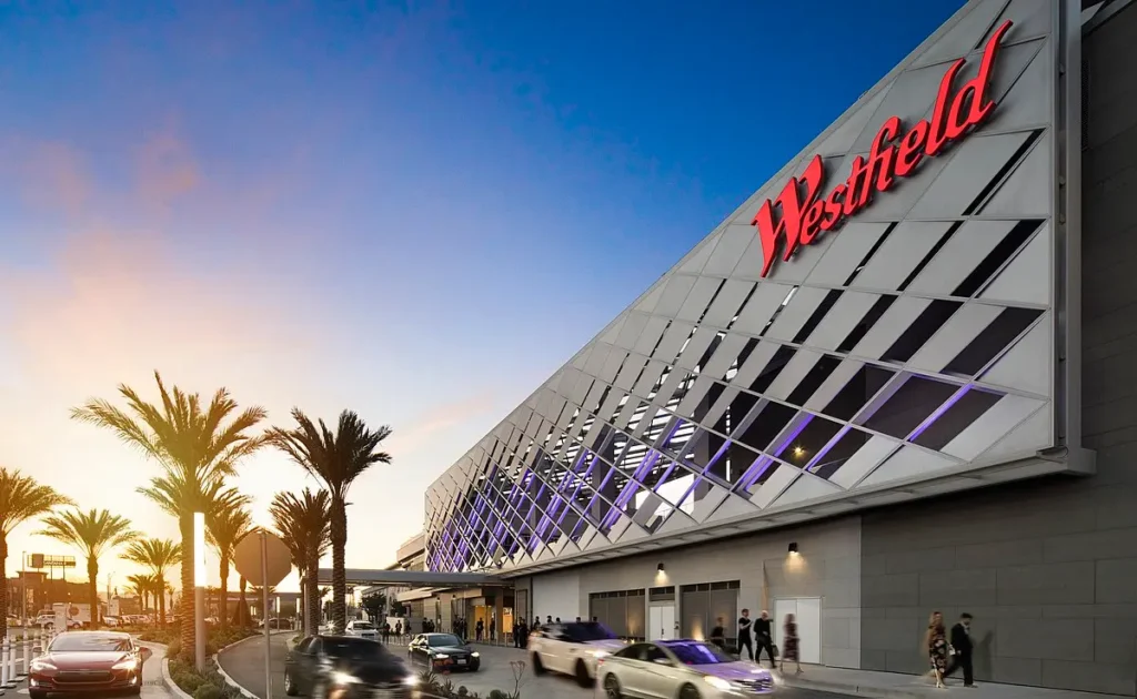 Exterior of Westfield Valley Fair Mall with parked cars in front.