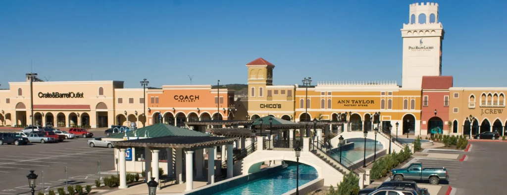 a bustling shopping center with a beautiful fountain