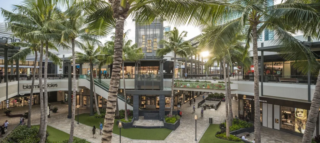 Atrium of Ala Moana Center Mall with palm trees.