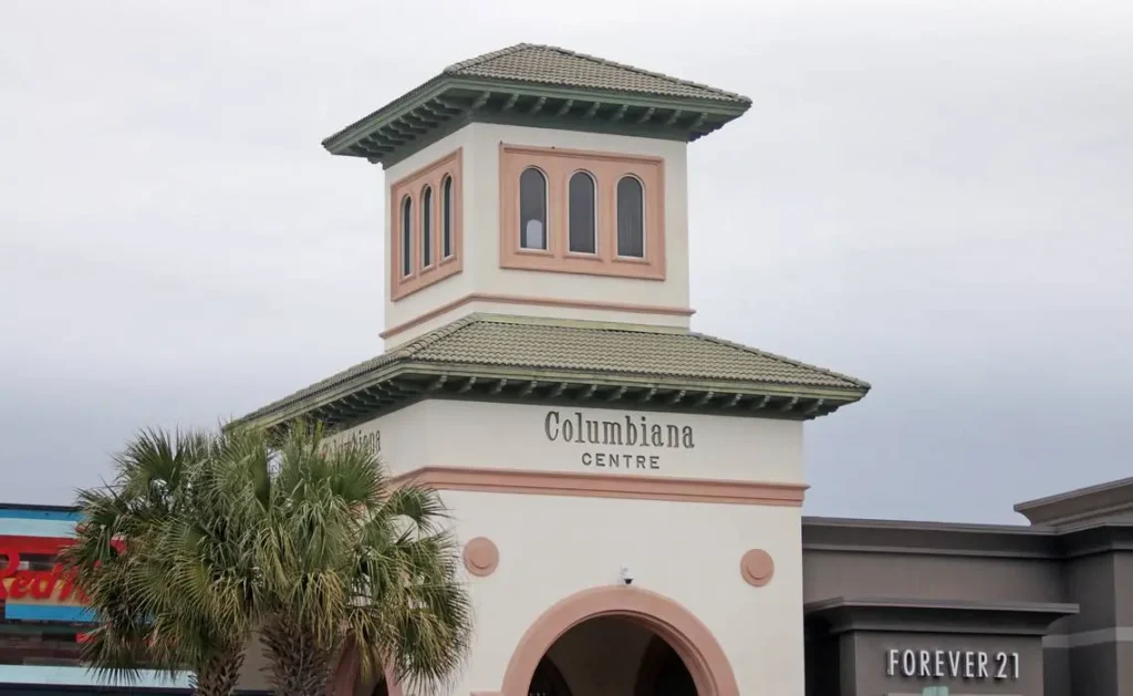 A clock tower stands in front of Columbiana Centre Mall