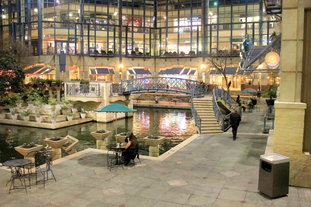 Patio furniture set up outside a building at Shops at Rivercenter Mall.