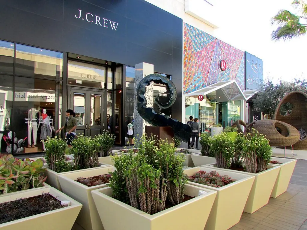 Westfield UTC Mall entrance with glass facade and bustling activity.