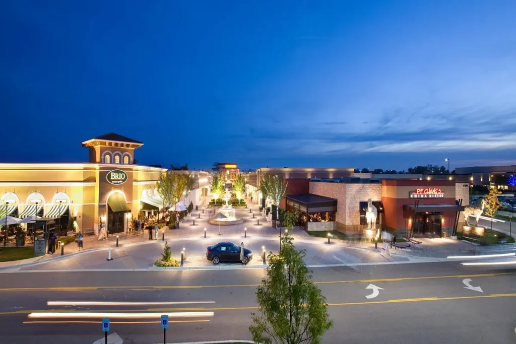 Night view of The Mall at Partridge Creek with a clock tower